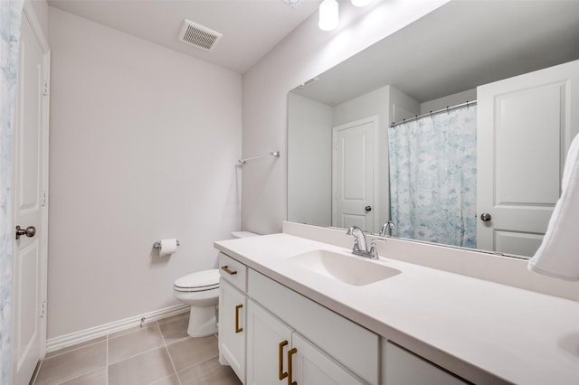 624 Cedarwood St, Little Elm, TX 76227 - bathroom with baseboards, tile patterned flooring, toilet, and vanity