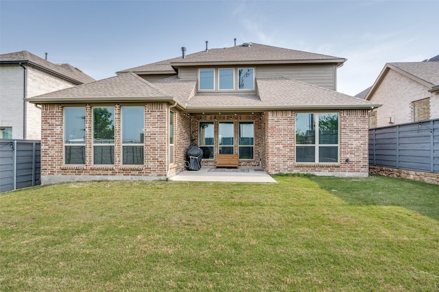 624 Cedarwood St, Little Elm, TX 76227 - rear view of property with a patio, a shingled roof, and brick siding