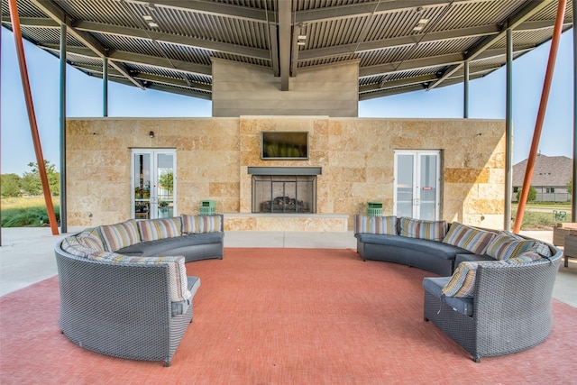 624 Cedarwood St, Little Elm, TX 76227 - view of patio with an outdoor living space with a fireplace and french doors