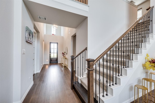 624 Cedarwood St, Little Elm, TX 76227 - foyer entrance featuring plenty of natural light, a towering ceiling, stairs, dark wood-style floors, and baseboards