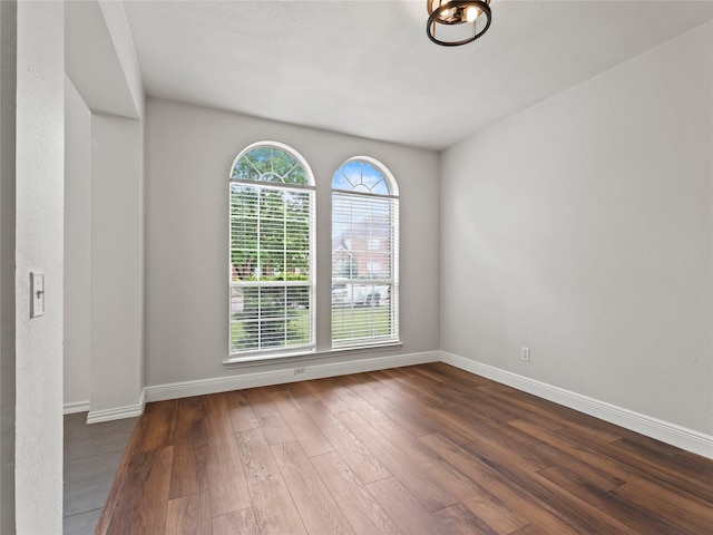 3000 Clearmeadow Dr, Mesquite, TX 75181 - empty room with dark wood-style flooring and baseboards