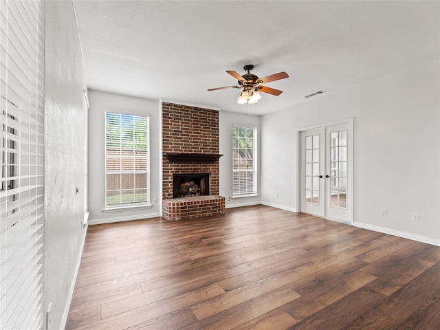 3000 Clearmeadow Dr, Mesquite, TX 75181 - unfurnished living room with healthy amount of natural light, wood finished floors, and a ceiling fan