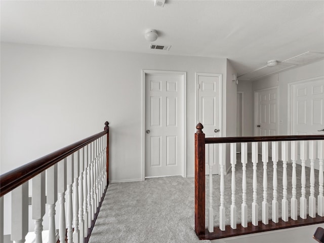 3000 Clearmeadow Dr, Mesquite, TX 75181 - hallway with attic access, carpet, an upstairs landing, and baseboards