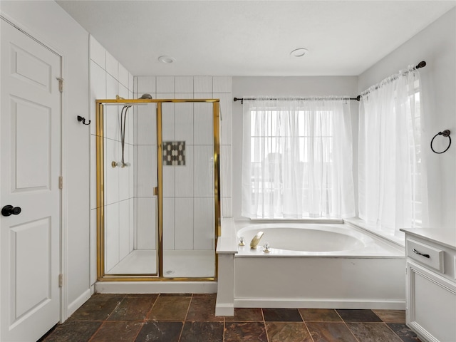3000 Clearmeadow Dr, Mesquite, TX 75181 - full bath with a stall shower, a garden tub, and stone finish floors