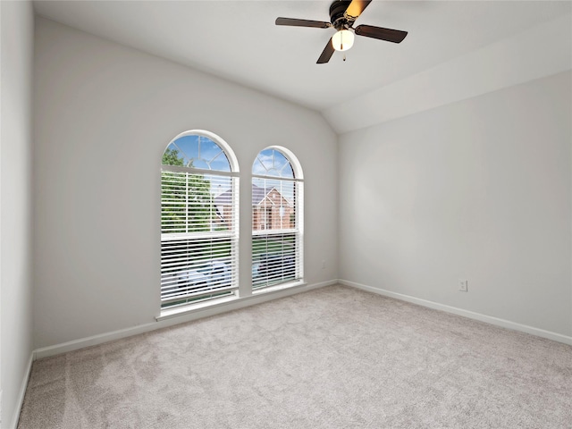 3000 Clearmeadow Dr, Mesquite, TX 75181 - spare room featuring carpet flooring, baseboards, a ceiling fan, and vaulted ceiling