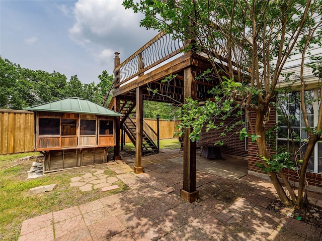 3000 Clearmeadow Dr, Mesquite, TX 75181 - view of patio featuring stairway, fence, and a deck