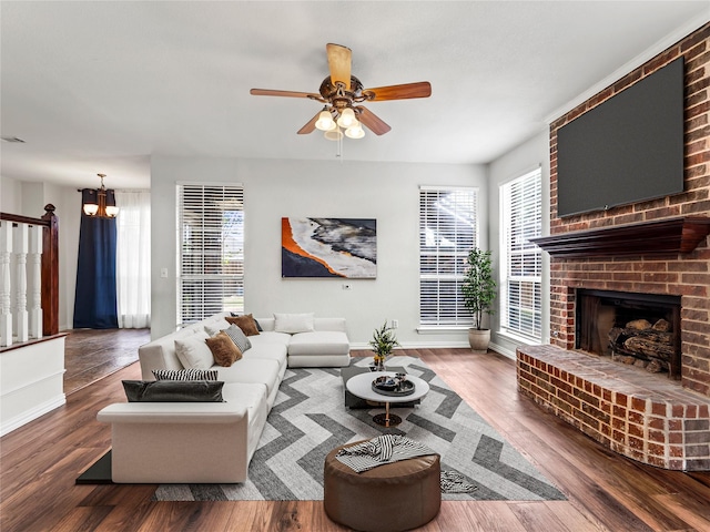 3000 Clearmeadow Dr, Mesquite, TX 75181 - living room featuring a ceiling fan, baseboards, wood finished floors, and a brick fireplace
