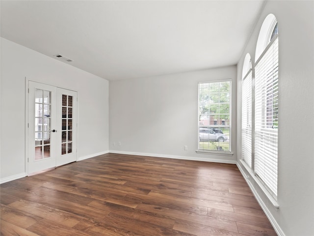 3000 Clearmeadow Dr, Mesquite, TX 75181 - spare room with french doors, dark wood-style flooring, and baseboards