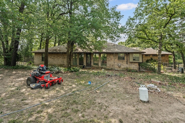 104 Murls Lake Rd, Weatherford, TX 76085 - rear view of house with fence and brick siding