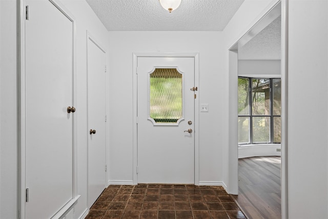 104 Murls Lake Rd, Weatherford, TX 76085 - doorway featuring a textured ceiling and baseboards