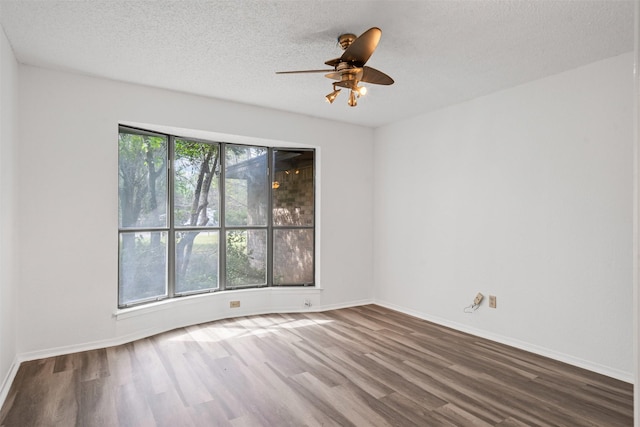 104 Murls Lake Rd, Weatherford, TX 76085 - spare room featuring wood finished floors, ceiling fan, a textured ceiling, and baseboards