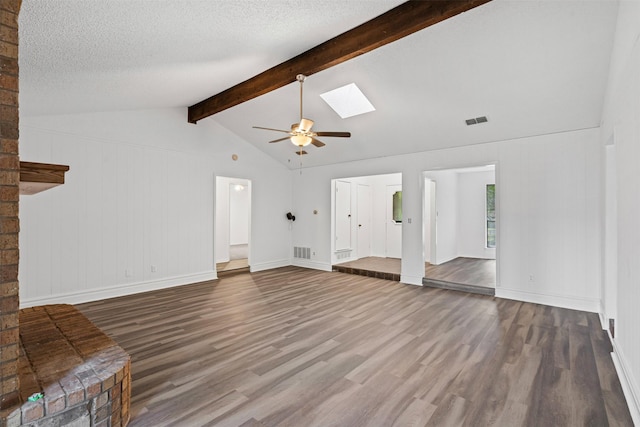 104 Murls Lake Rd, Weatherford, TX 76085 - unfurnished living room with wood finished floors, a ceiling fan, a skylight, and a textured ceiling