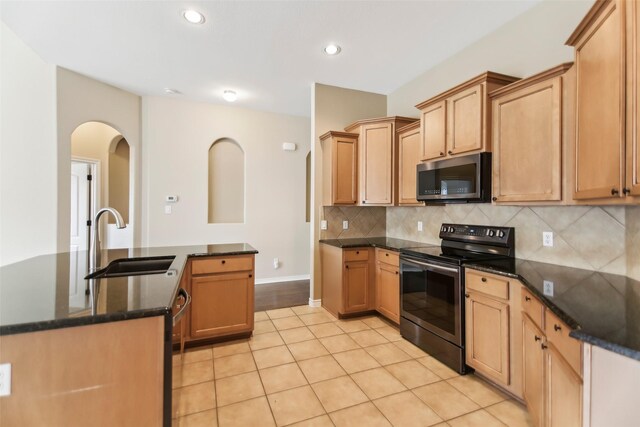 5900 Pansy Rd, Fort Worth, TX 76123 - kitchen with appliances with stainless steel finishes, a sink, tasteful backsplash, recessed lighting, and light tile patterned floors