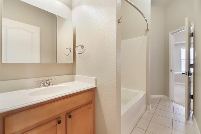 5900 Pansy Rd, Fort Worth, TX 76123 - full bath with tile patterned floors, vanity, baseboards, and shower / washtub combination