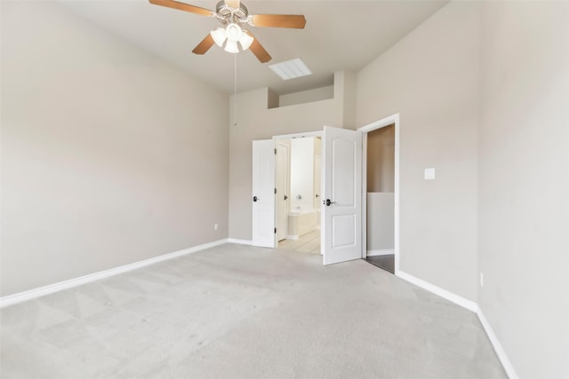 5900 Pansy Rd, Fort Worth, TX 76123 - unfurnished bedroom featuring light colored carpet, baseboards, ensuite bathroom, a ceiling fan, and a high ceiling
