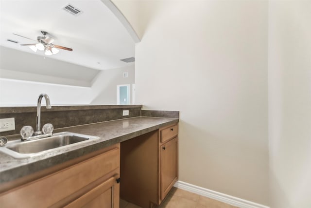 5900 Pansy Rd, Fort Worth, TX 76123 - kitchen featuring a sink, dark countertops, vaulted ceiling, ceiling fan, and arched walkways