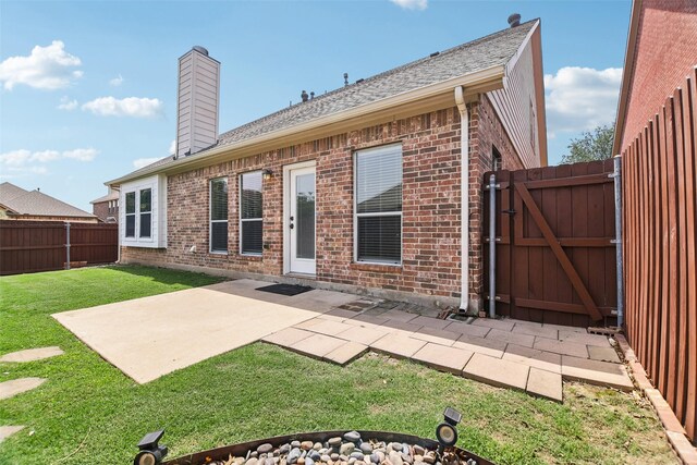 5900 Pansy Rd, Fort Worth, TX 76123 - back of property with brick siding, a gate, a chimney, a patio, and a shingled roof