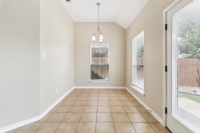 5900 Pansy Rd, Fort Worth, TX 76123 - unfurnished dining area featuring vaulted ceiling, a chandelier, healthy amount of natural light, light tile patterned floors, and baseboards
