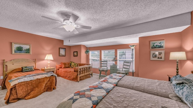 5122 La Vista Ct, Granbury, TX 76049 - bedroom featuring light carpet, a textured ceiling, ceiling fan, and baseboards