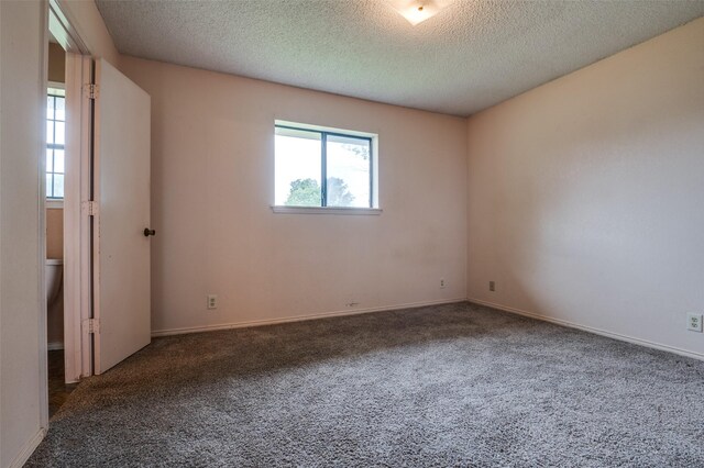 104 Bluebonnet Ln, Palmer, TX 75152 - unfurnished room with carpet floors, a textured ceiling, and baseboards