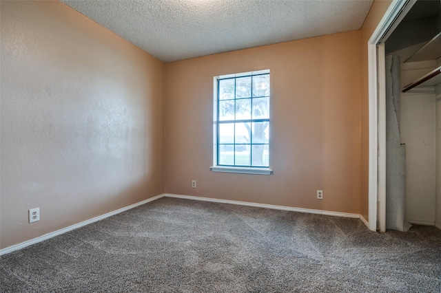 104 Bluebonnet Ln, Palmer, TX 75152 - unfurnished bedroom featuring carpet, baseboards, and a textured ceiling