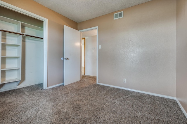 104 Bluebonnet Ln, Palmer, TX 75152 - unfurnished bedroom featuring carpet, baseboards, and a textured ceiling