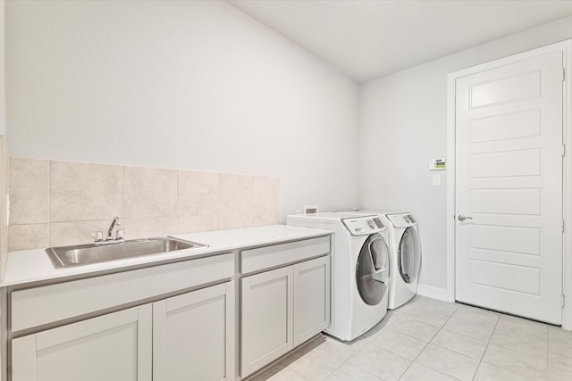 2540 Bottlebrush Dr, Prosper, TX 75078 - laundry area featuring cabinet space, washer and clothes dryer, and light tile patterned floors
