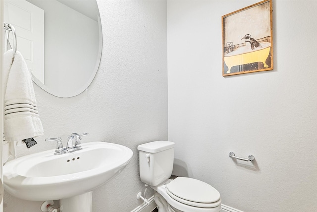 2540 Bottlebrush Dr, Prosper, TX 75078 - half bath featuring baseboards, a sink, and toilet
