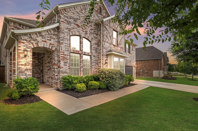 2540 Bottlebrush Dr, Prosper, TX 75078 - view of front of house featuring a yard and brick siding