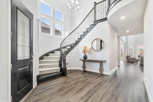 2540 Bottlebrush Dr, Prosper, TX 75078 - entryway featuring wood finished floors, stairway, a chandelier, baseboards, and a towering ceiling