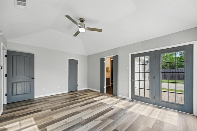 8805 Wood Glen Dr, Rowlett, TX 75088 - unfurnished bedroom with lofted ceiling, access to outside, wood finished floors, connected bathroom, and ceiling fan