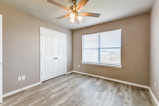 4032 Red Rock, Heartland, TX 75126 - unfurnished bedroom featuring light wood-style flooring, a closet, and baseboards