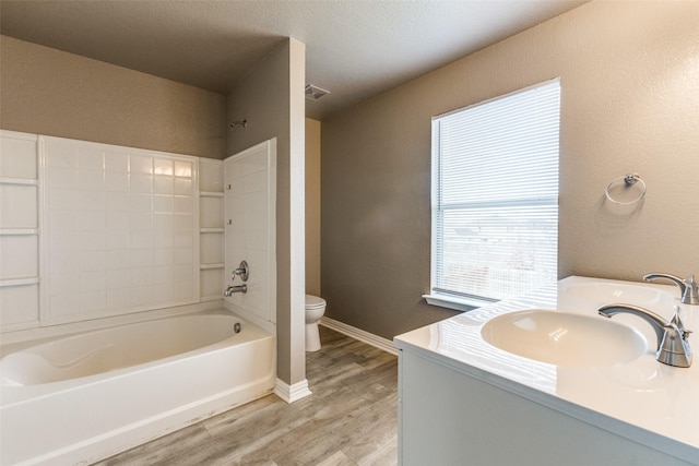 4032 Red Rock, Heartland, TX 75126 - full bath featuring wood finished floors, a textured wall, toilet, shower / tub combination, and vanity