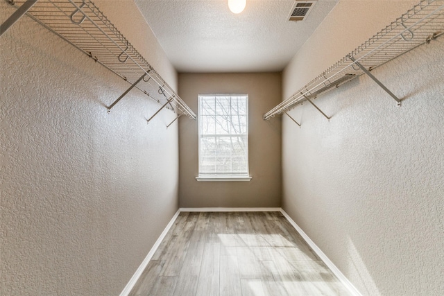 4032 Red Rock, Heartland, TX 75126 - spacious closet with wood finished floors