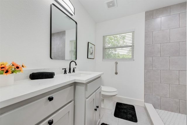 10166 San Lorenzo Dr, Dallas, TX 75228 - bathroom featuring vanity, tile patterned floors, toilet, baseboards, and a tile shower