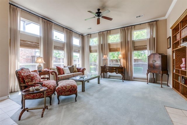 3671 Navarro Way, Frisco, TX 75034 - carpeted living area with a ceiling fan, baseboards, ornamental molding, and tile patterned flooring