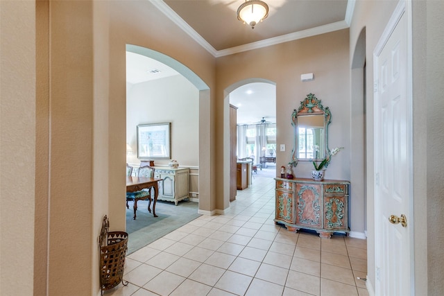 3671 Navarro Way, Frisco, TX 75034 - hall featuring arched walkways, light tile patterned flooring, crown molding, baseboards, and light carpet