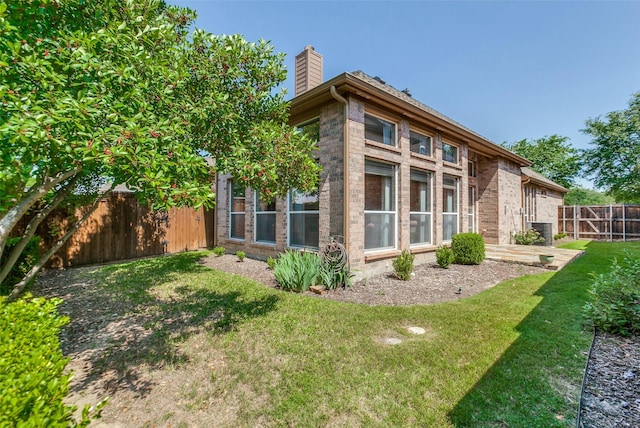 3671 Navarro Way, Frisco, TX 75034 - rear view of property featuring a chimney and brick siding