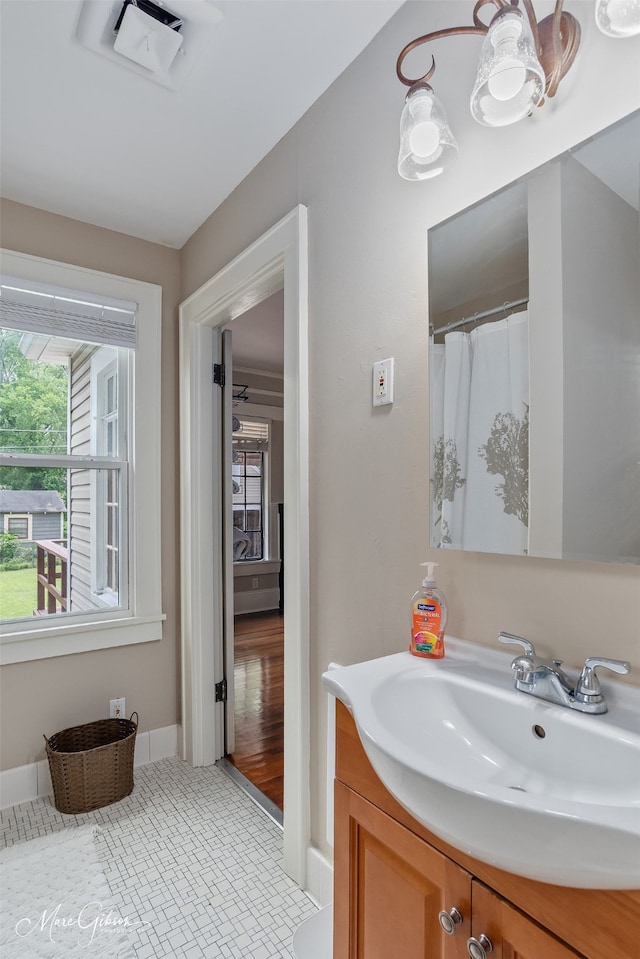 bathroom with vanity and baseboards