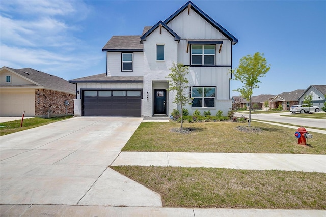 600 Trinity Park Trl, Alvarado, TX 76009 - view of front of house featuring board and batten siding, a front lawn, concrete driveway, and a garage