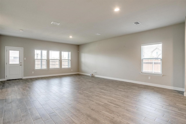 600 Trinity Park Trl, Alvarado, TX 76009 - empty room featuring wood finished floors, plenty of natural light, baseboards, and recessed lighting
