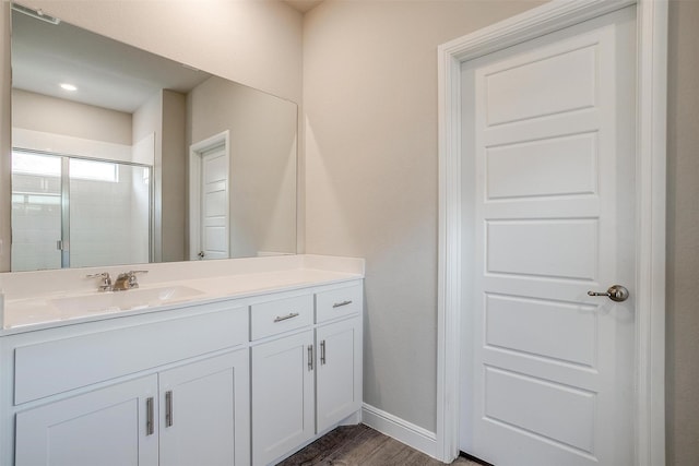 600 Trinity Park Trl, Alvarado, TX 76009 - bathroom with a shower stall, vanity, wood finished floors, and baseboards