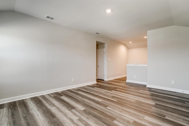 600 Trinity Park Trl, Alvarado, TX 76009 - spare room with lofted ceiling, wood finished floors, recessed lighting, and baseboards