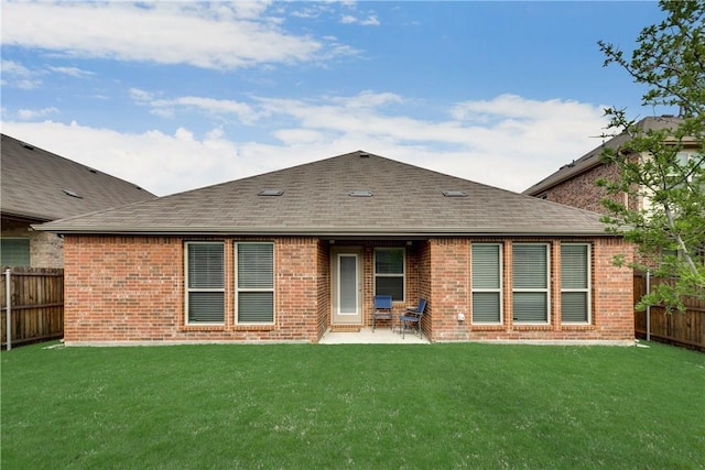 3804 Tunstall Dr, Frisco, TX 75036 - rear view of house featuring roof with shingles, brick siding, and a patio