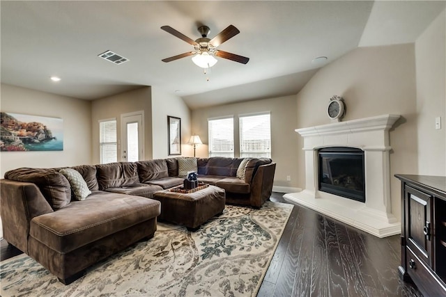 3804 Tunstall Dr, Frisco, TX 75036 - living area with wood finished floors, a ceiling fan, a glass covered fireplace, recessed lighting, and lofted ceiling