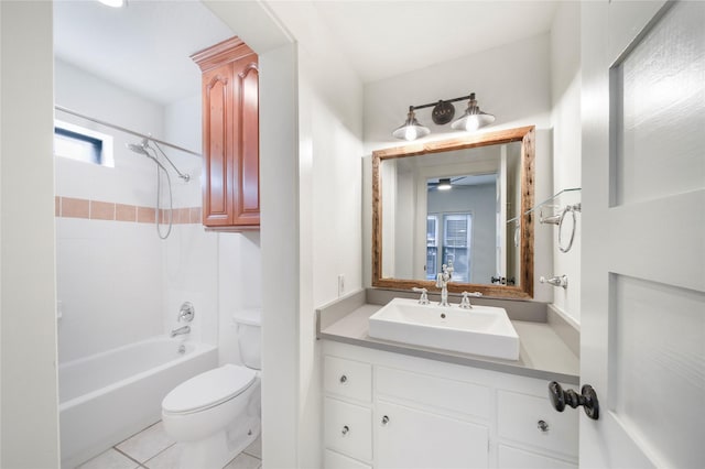 bathroom featuring toilet, vanity, ceiling fan, shower / tub combination, and tile patterned flooring