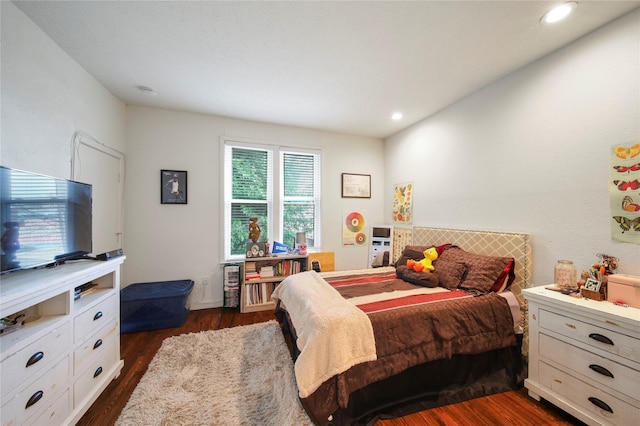 bedroom with dark wood finished floors and recessed lighting