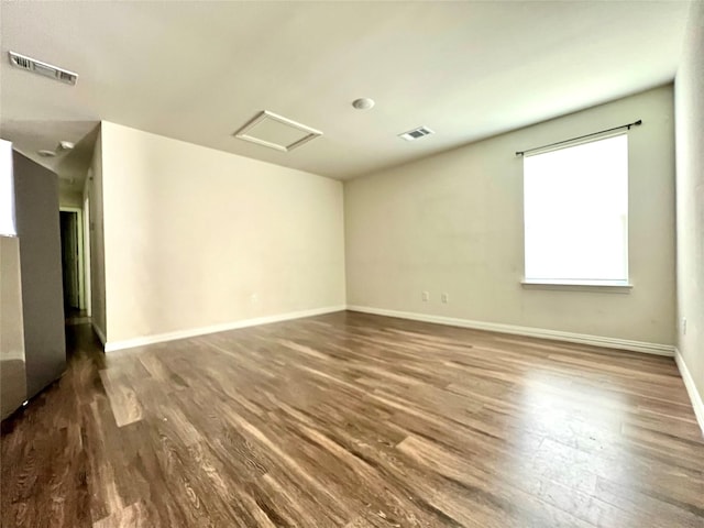 710 S 20th St, Temple, TX 76501 - unfurnished room with attic access, wood finished floors, and baseboards