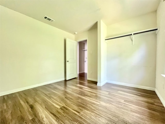 710 S 20th St, Temple, TX 76501 - unfurnished bedroom with wood finished floors, baseboards, and a closet