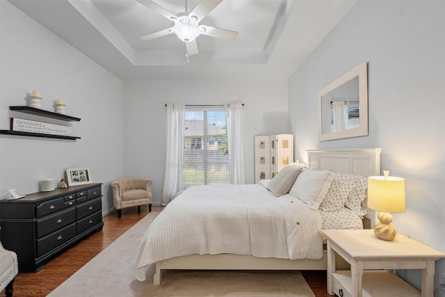 221 Whitestone Way, Weatherford, TX 76085 - bedroom with a tray ceiling, dark wood finished floors, and ceiling fan